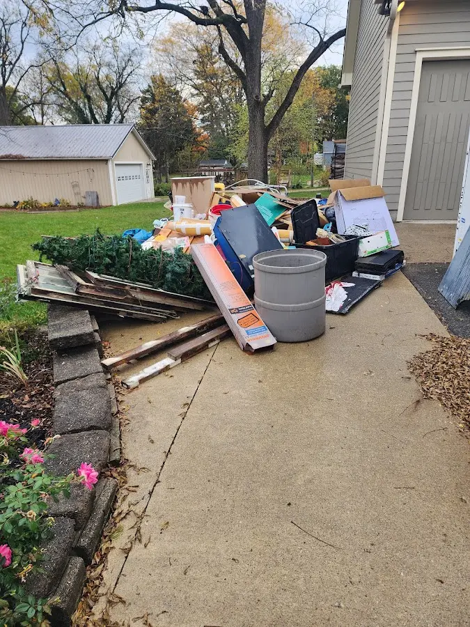 Dumpster being loaded with debris for Roofing Dumpster Rental in Redwood City